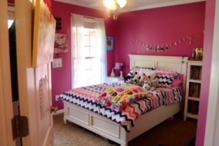 475 Tom Grissom Road Morrison, TN 37357 - Photo 11 of 17 a bed sitting in a bedroom next to a window