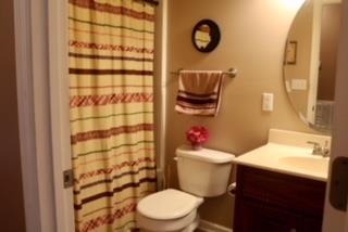 475 Tom Grissom Road Morrison, TN 37357 - Photo 13 of 17 a white toilet sitting next to a bathroom sink