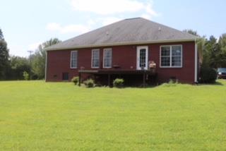 475 Tom Grissom Road Morrison, TN 37357 - Photo 17 of 17 a front view of a house with a garden and yard