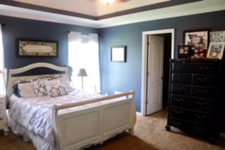 475 Tom Grissom Road Morrison, TN 37357 - Photo 8 of 17 a bedroom with a bed and a dresser