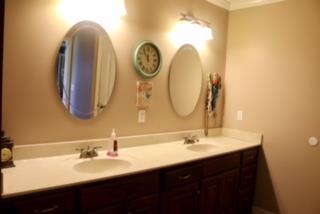 475 Tom Grissom Road Morrison, TN 37357 - Photo 9 of 17 a bathroom with a double vanity sink and a mirror