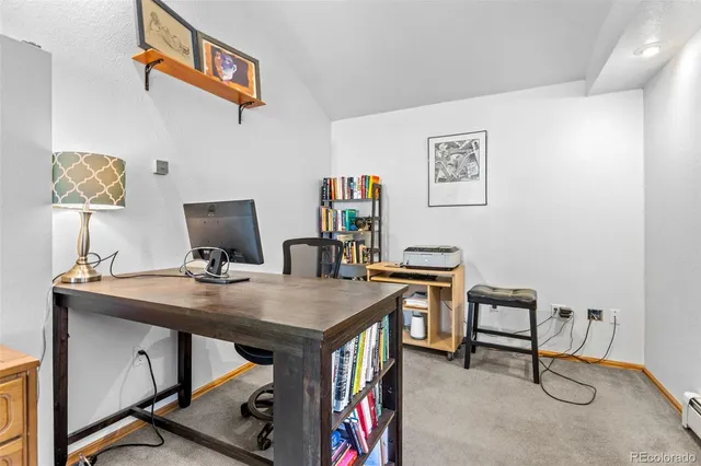 a view of a workspace with furniture