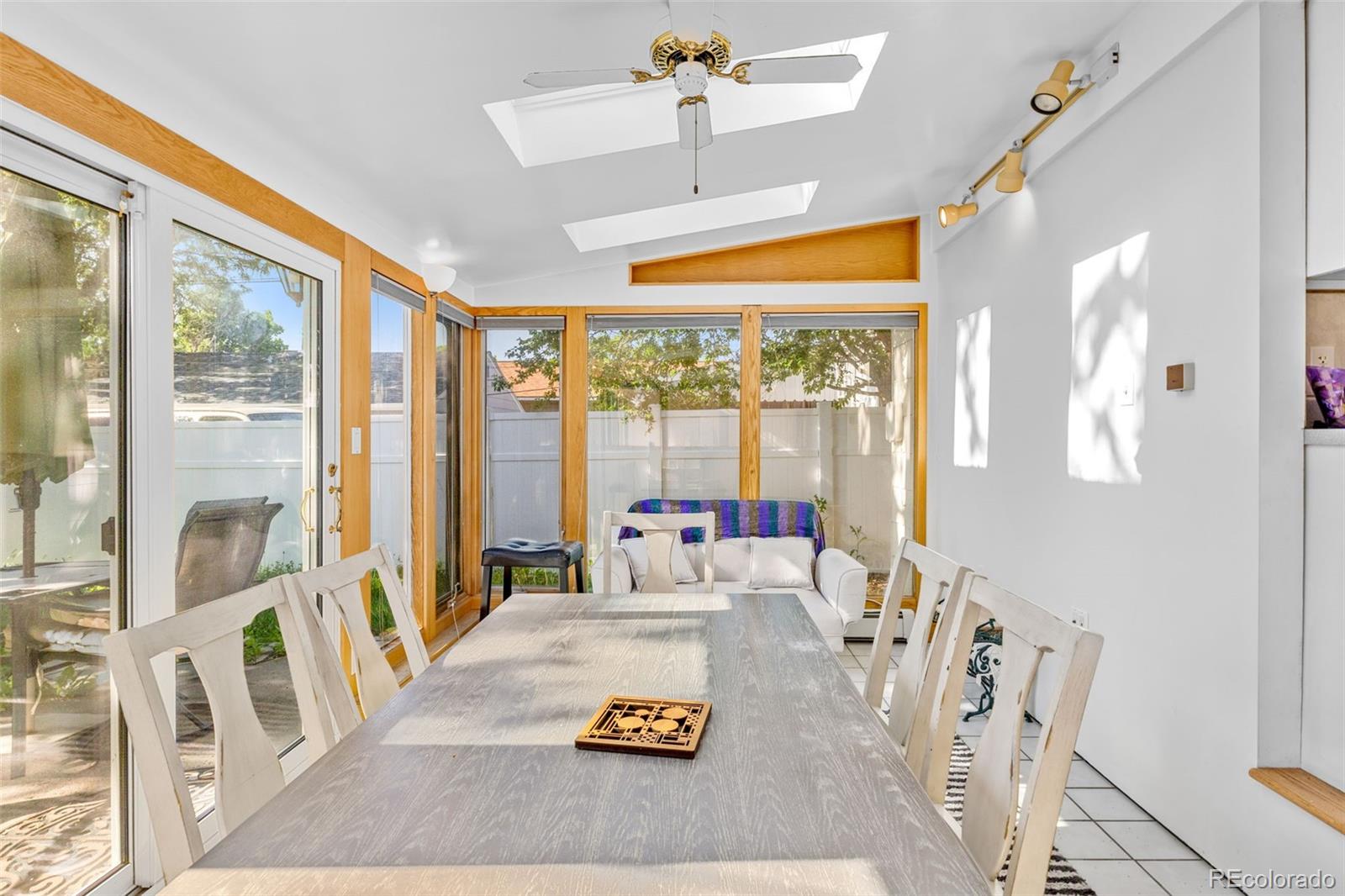 1732 Lansing Street Aurora, CO 80010 - Photo 23 of 37 a living room with furniture and a large window