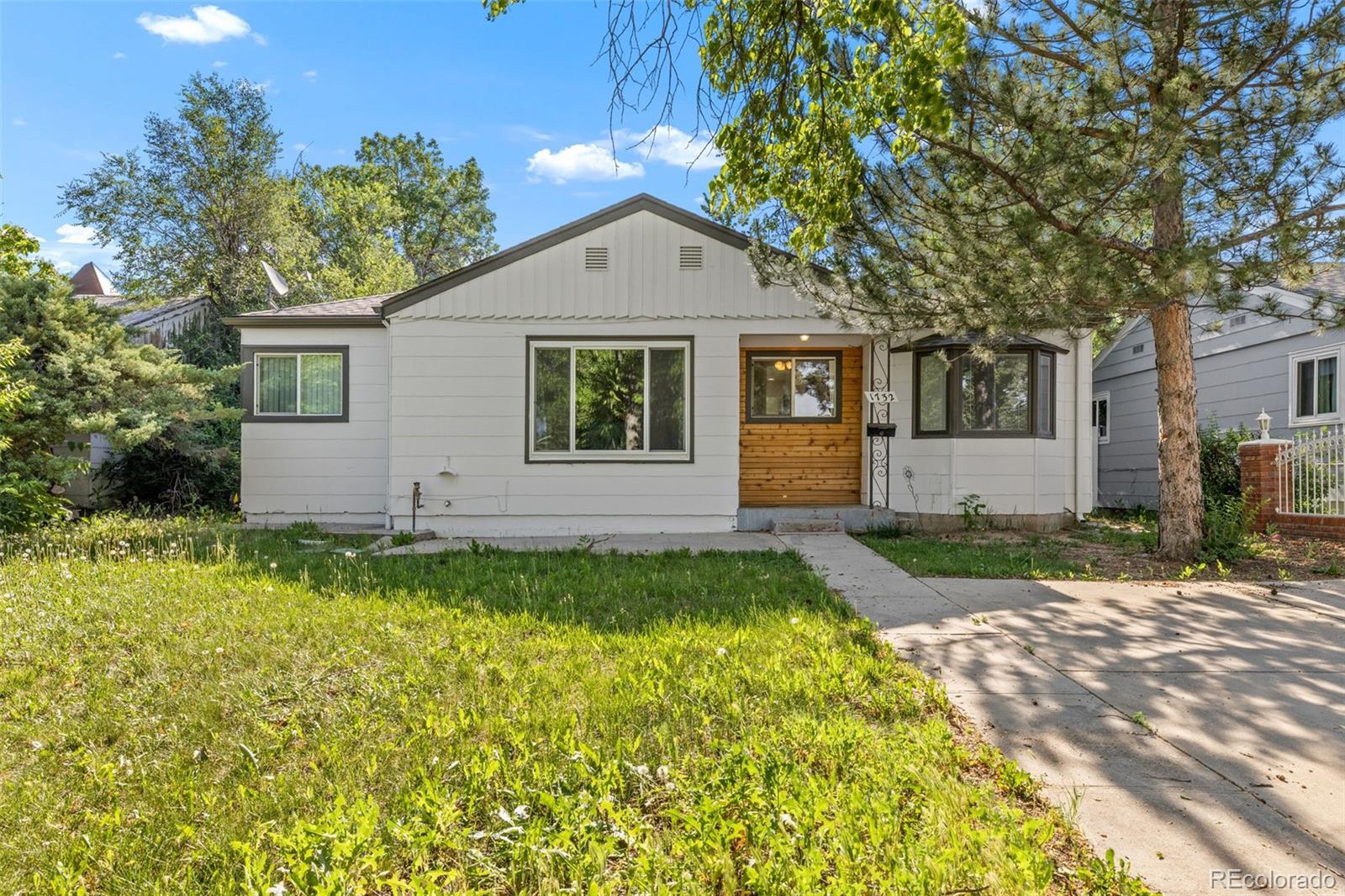 1732 Lansing Street Aurora, CO 80010 - Photo 37 of 37 a view of a house with a yard