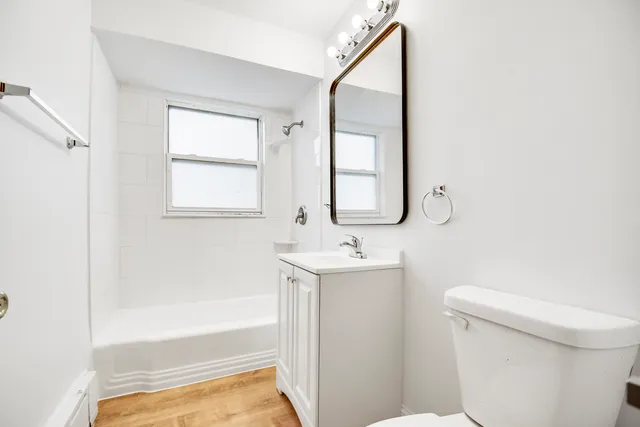 a bathroom with a sink a toilet and bathtub