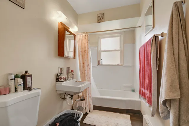 a bathroom with a bathtub and a sink