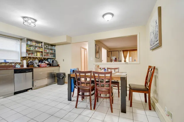 a kitchen with a table and chairs in it