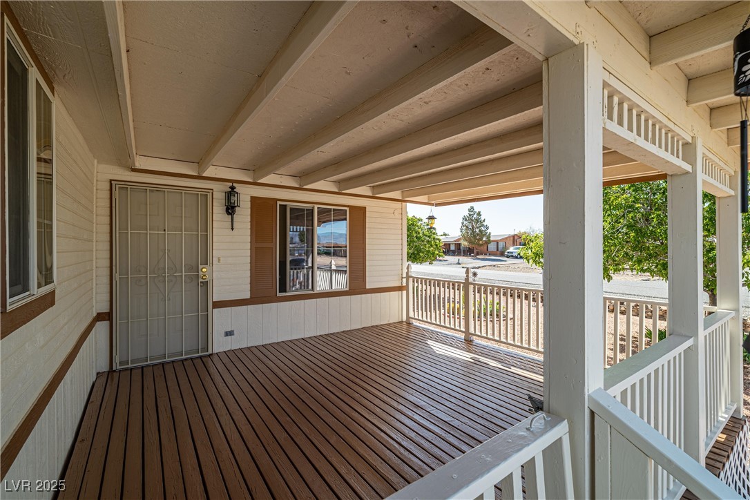 5632 Saddletree Road Pahrump, NV 89061 - Photo 6 of 40 Wooden deck featuring a grill
