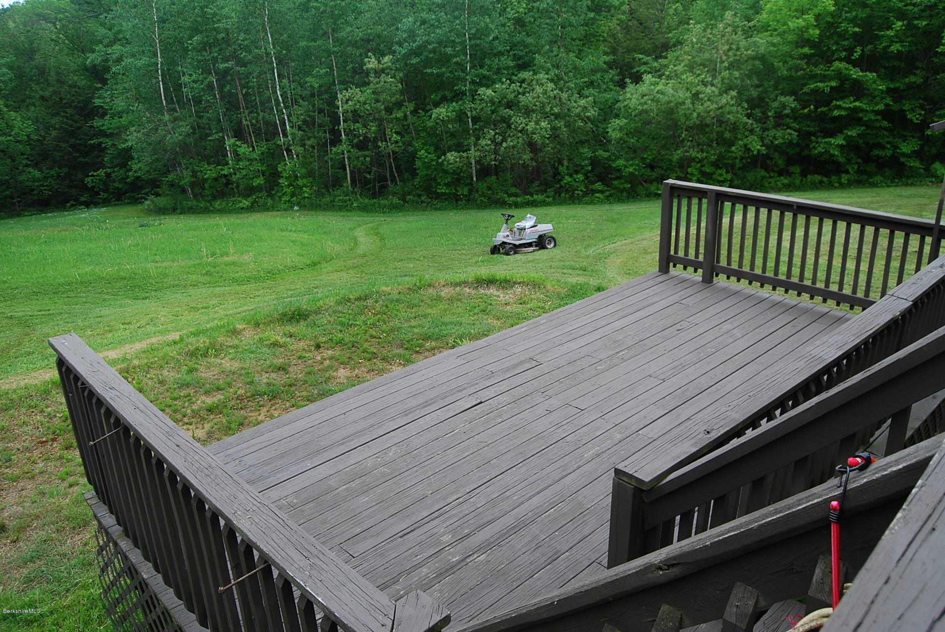 196 Chapel Road Savoy, MA 01256 - Photo 4 of 22 a view of a wooden floor and a yard in the back