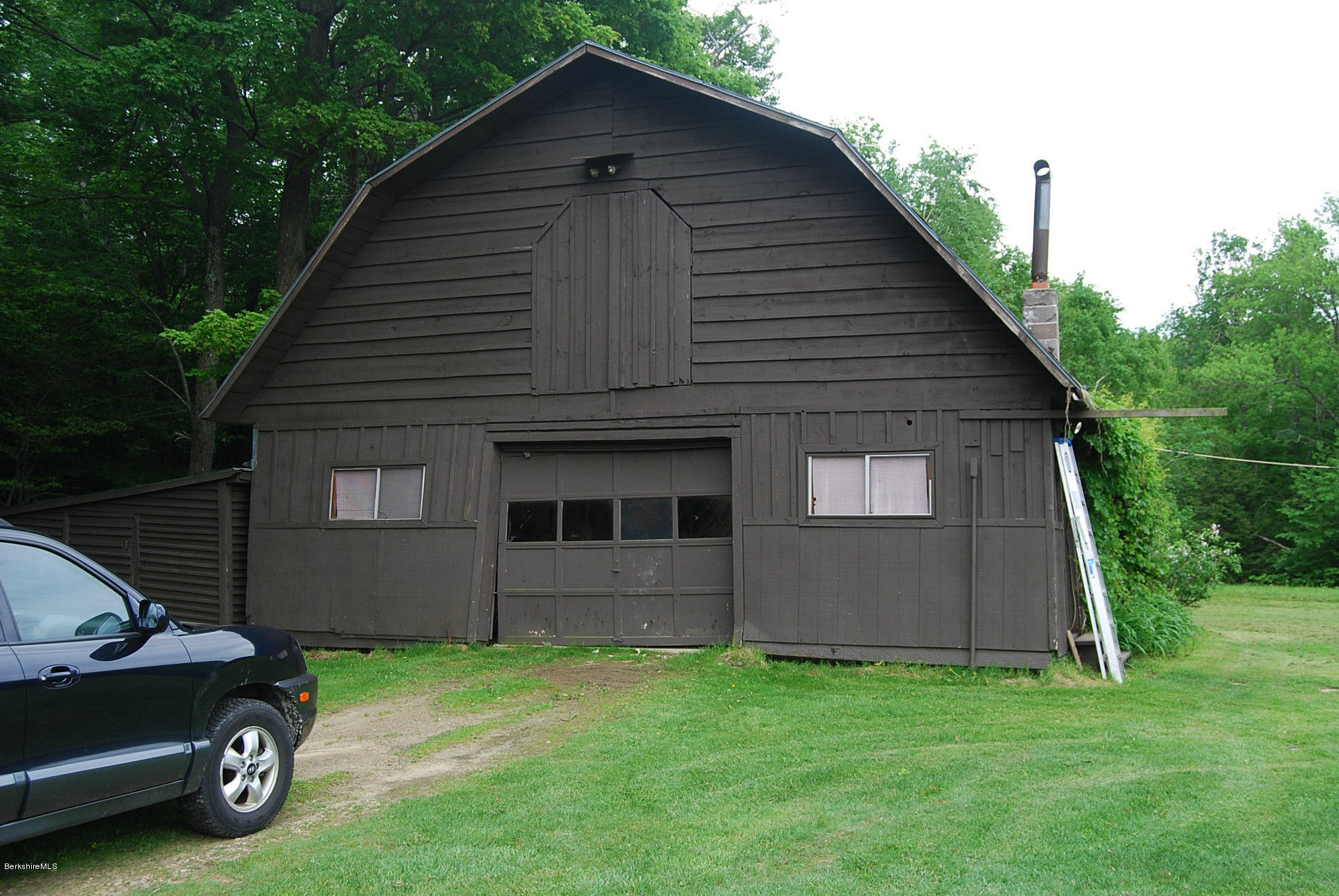 196 Chapel Road Savoy, MA 01256 - Photo 7 of 22 a front view of a house with a yard