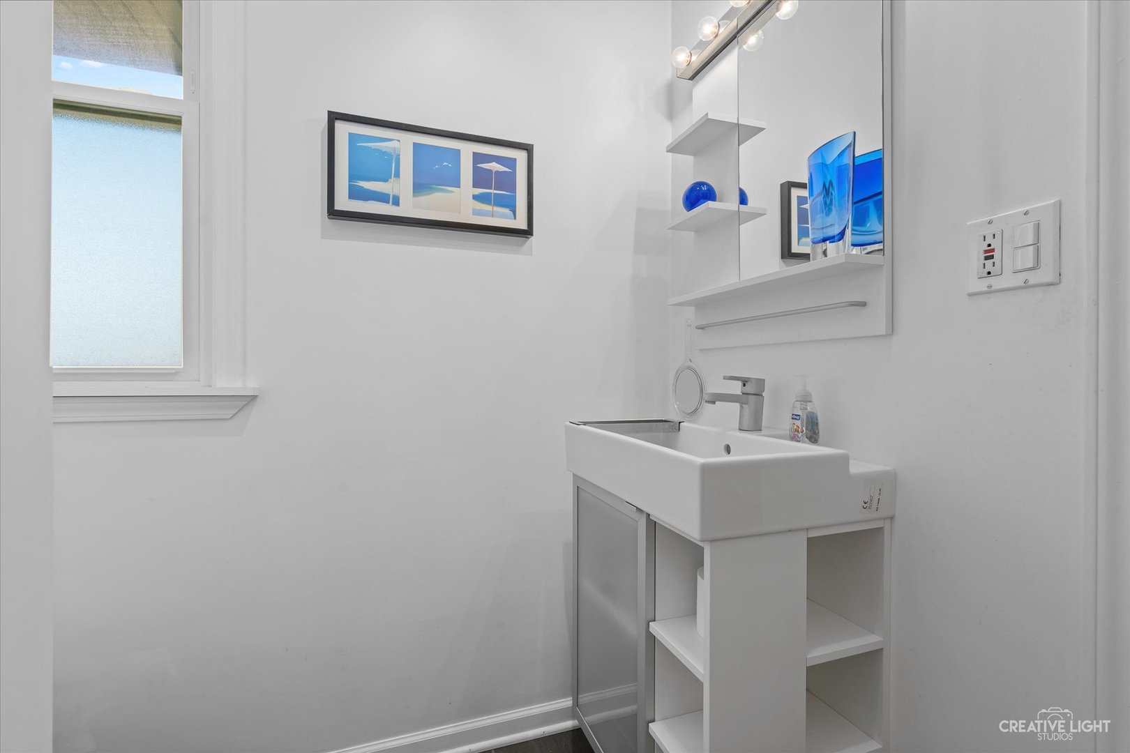 12-n058 Randall Road Elgin, IL 60123 - Photo 13 of 23 a bathroom with a sink and a mirror