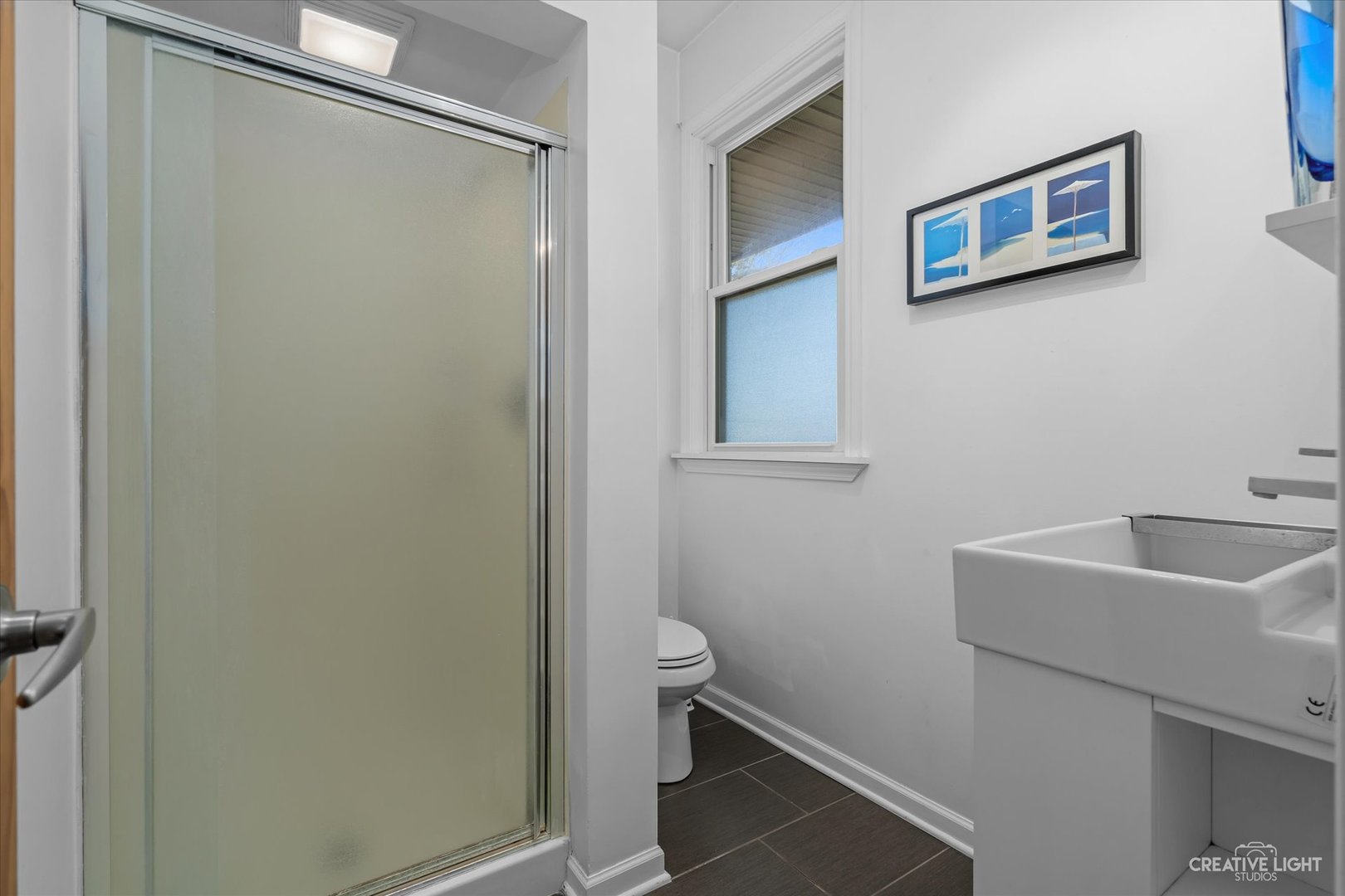 12-n058 Randall Road Elgin, IL 60123 - Photo 14 of 23 a bathroom with a sink and a toilet