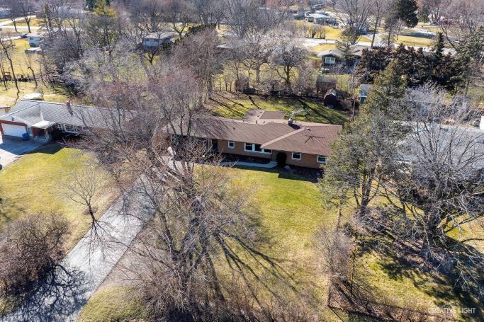 12-n058 Randall Road Elgin, IL 60123 - Photo 23 of 23 a aerial view of a house with swimming pool and large trees