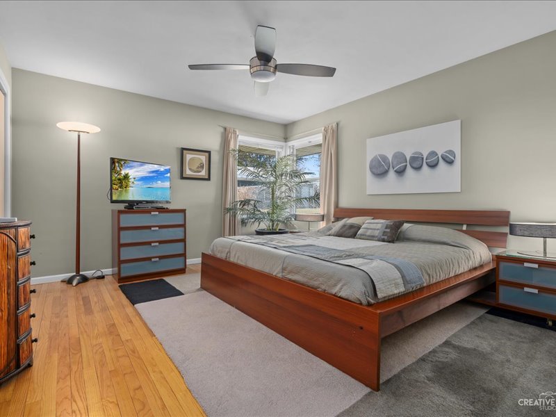 12-n058 Randall Road Elgin, IL 60123 - Photo 8 of 23 a bedroom with a bed and a chandelier