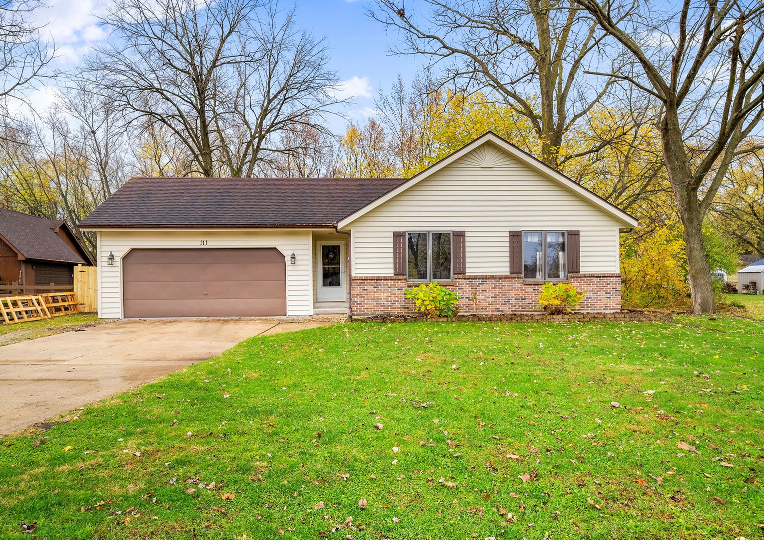 111 East Schmidt Road Braidwood, IL 60408 - Photo 1 of 23 a view of a yard in front of a house with large trees
