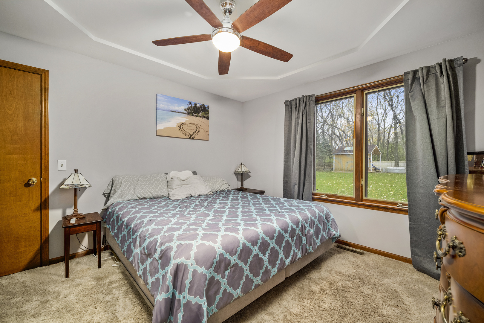111 East Schmidt Road Braidwood, IL 60408 - Photo 12 of 23 a bedroom with a bed and a large window