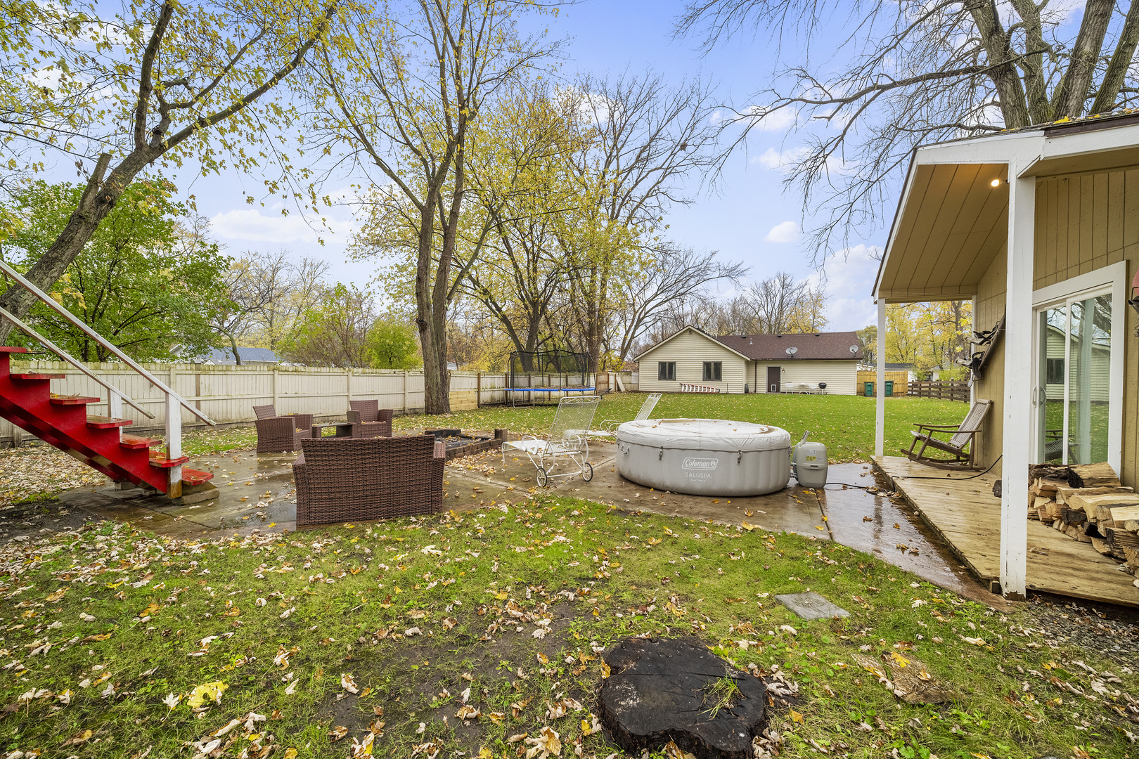 111 East Schmidt Road Braidwood, IL 60408 - Photo 18 of 23 a view of a backyard with table and chairs potted plants and large tree