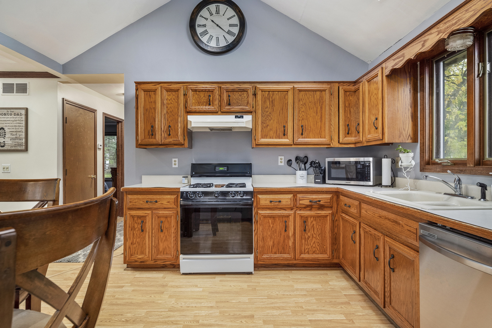 111 East Schmidt Road Braidwood, IL 60408 - Photo 10 of 23 a kitchen with stainless steel appliances granite countertop a stove a sink dishwasher and a refrigerator