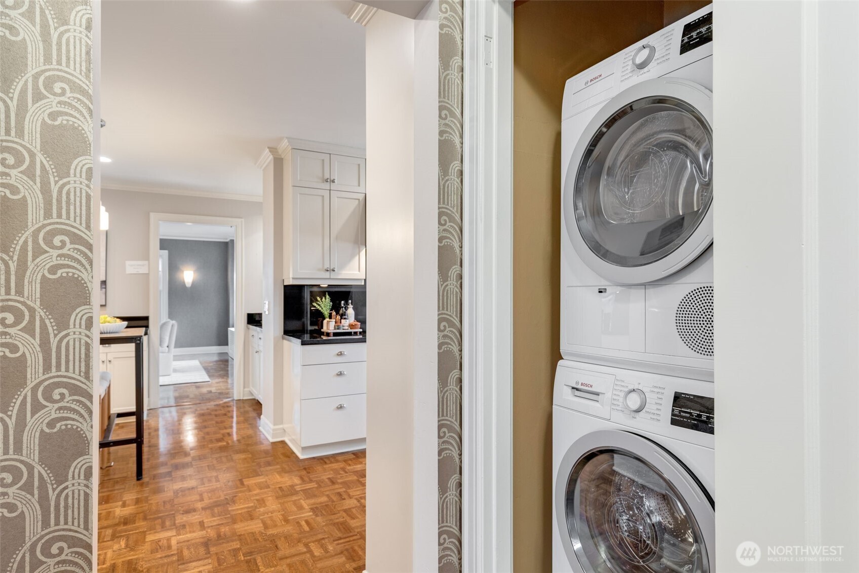 1223 Spring Street, Unit 700 Seattle, WA 98104 - Photo 20 of 35 a view of a kitchen with washer and dryer