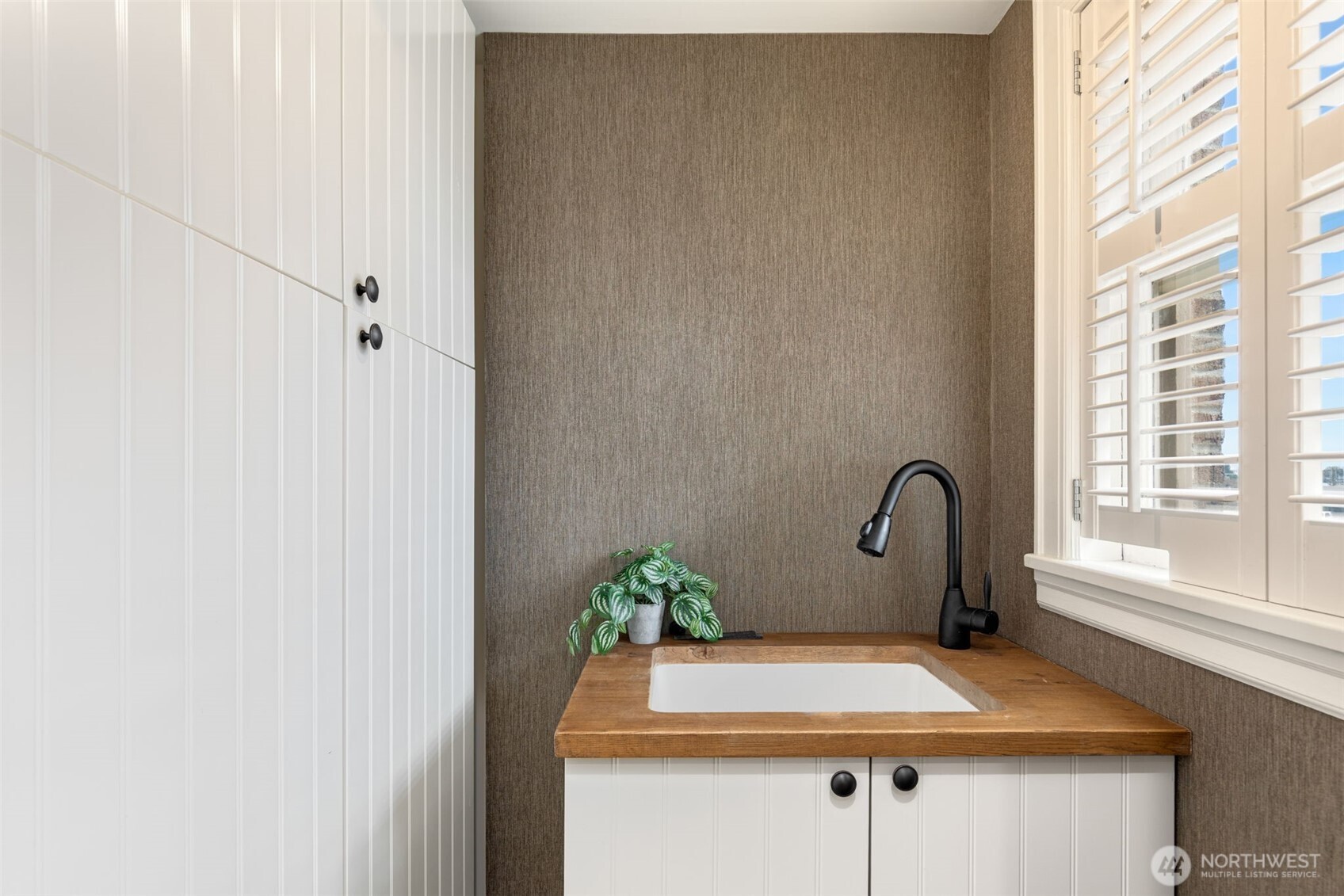 1223 Spring Street, Unit 700 Seattle, WA 98104 - Photo 22 of 35 a bathroom with a sink and mirror