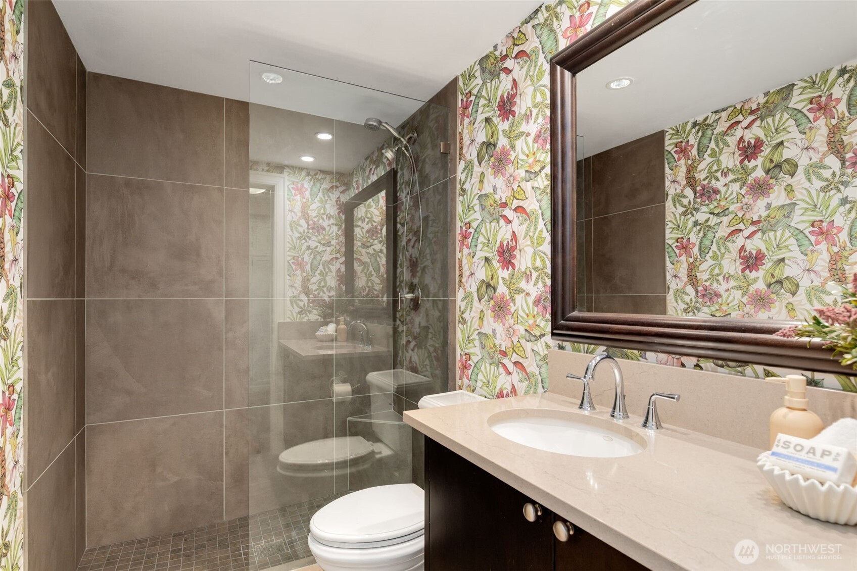 1223 Spring Street, Unit 700 Seattle, WA 98104 - Photo 27 of 35 a bathroom with a sink toilet and shower