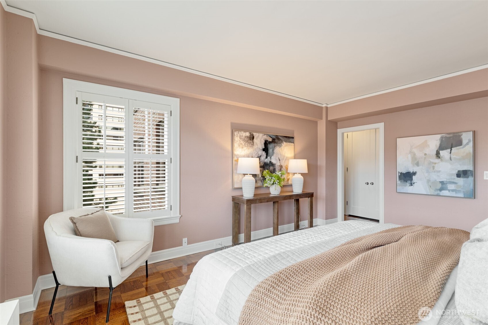 1223 Spring Street, Unit 700 Seattle, WA 98104 - Photo 29 of 35 a bedroom with a bed table and a window