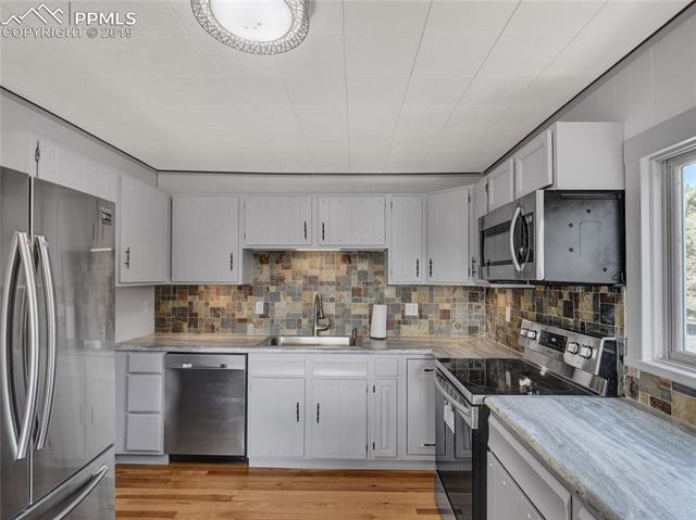 9915 Mesa Road Cascade, CO 80809 - Photo 10 of 25 New Refrigerator, Range/Oven, Dishwasher, Microwave