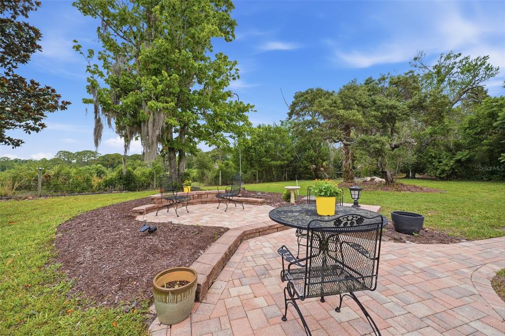 5227 Suwannee Road Weeki Wachee, FL 34607 - Photo 42 of 62 a view of a swimming pool and lounge chairs