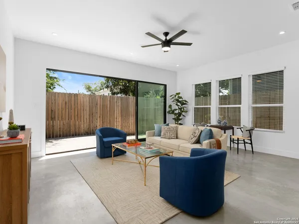 a living room with furniture and a large window
