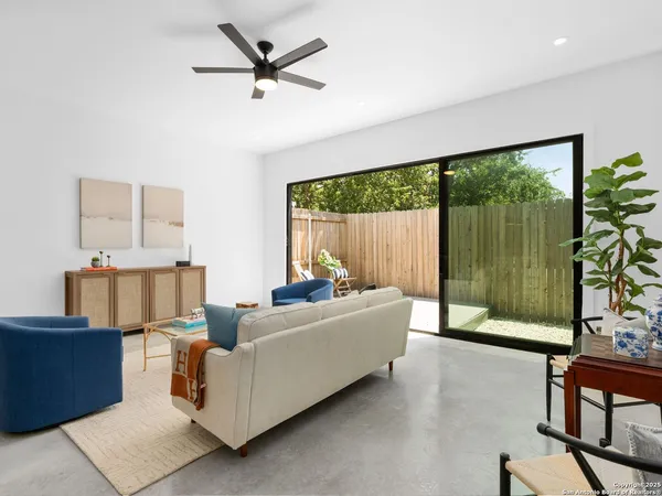 a living room with furniture and a large window