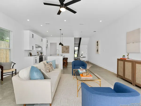 a living room with furniture and a window