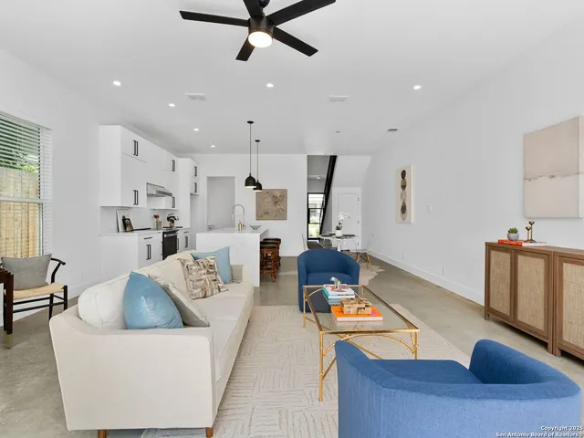 a living room with furniture and a window