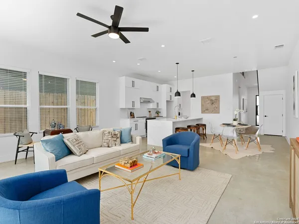 a living room with furniture and a large window