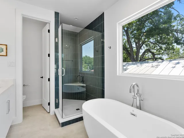 a bathroom with a bathtub and a sink