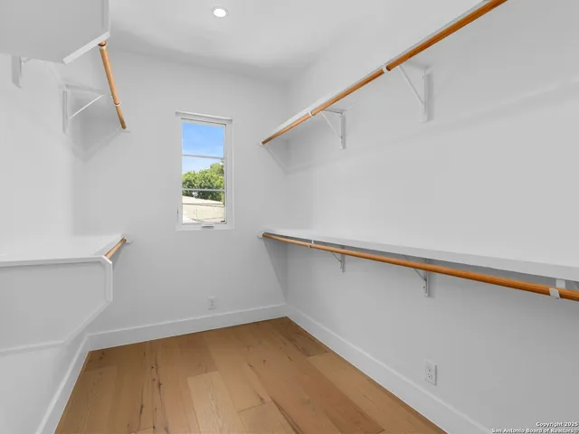 a view of a hallway with stairs