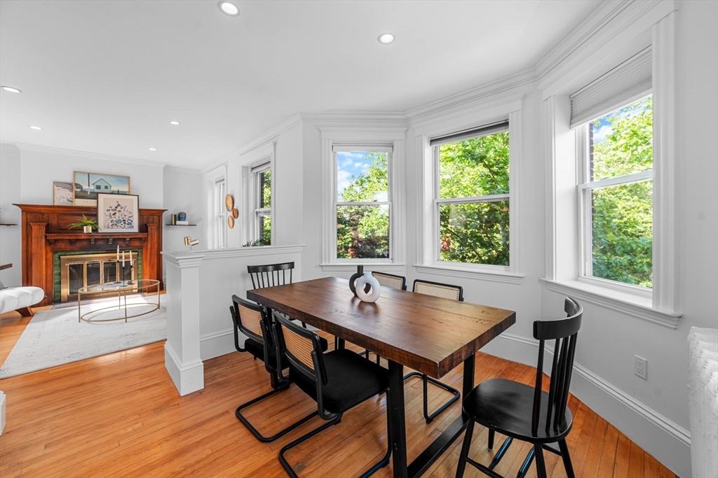 236 Rawson Road, Unit 5 Brookline, MA 02445 - Photo 15 of 38 a view of a dining room with furniture and wooden floor