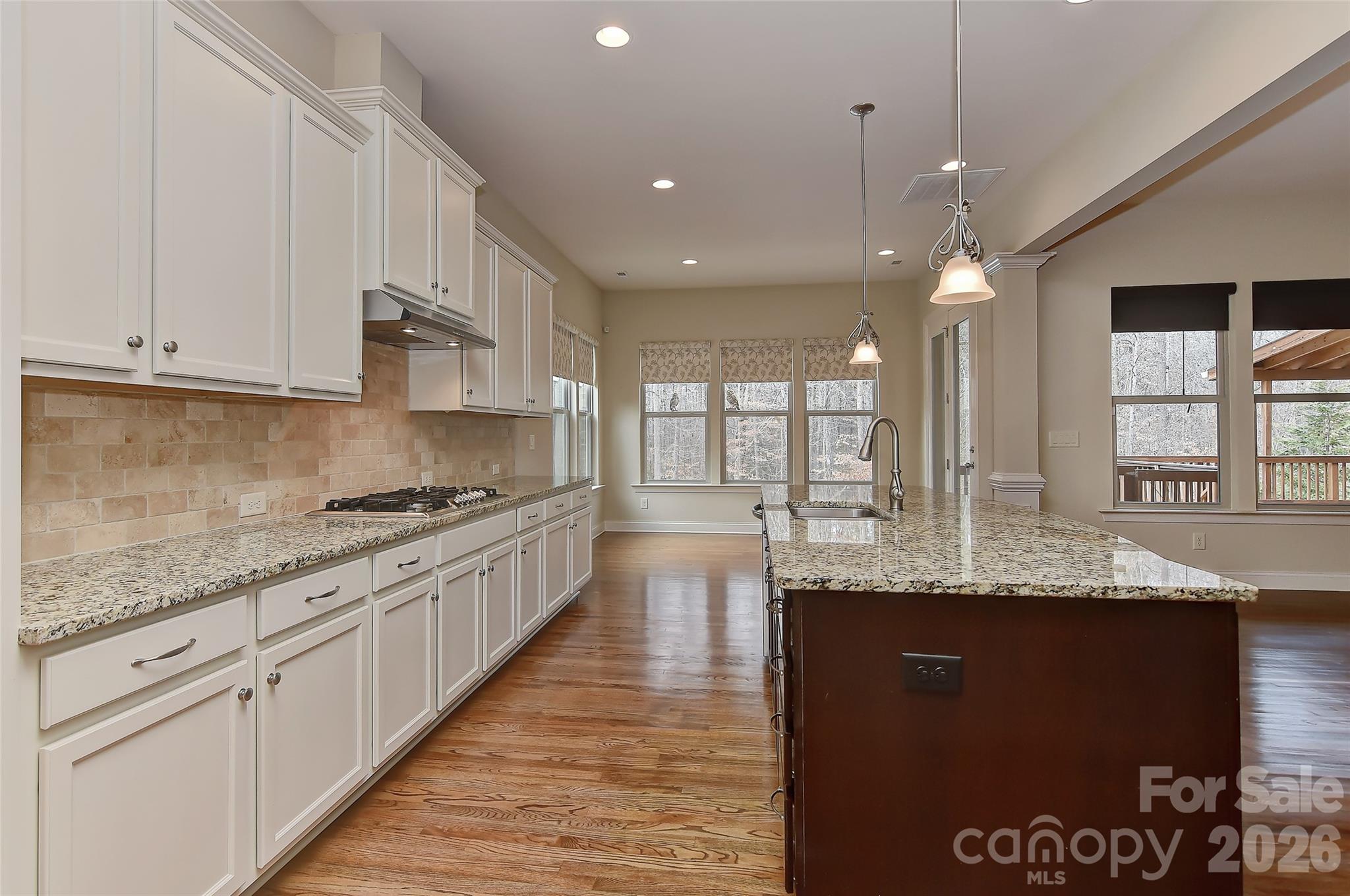 2287 Sweet Clover Way Denver, NC 28037 - Photo 18 of 44 a large kitchen with granite countertop lots of counter space and window