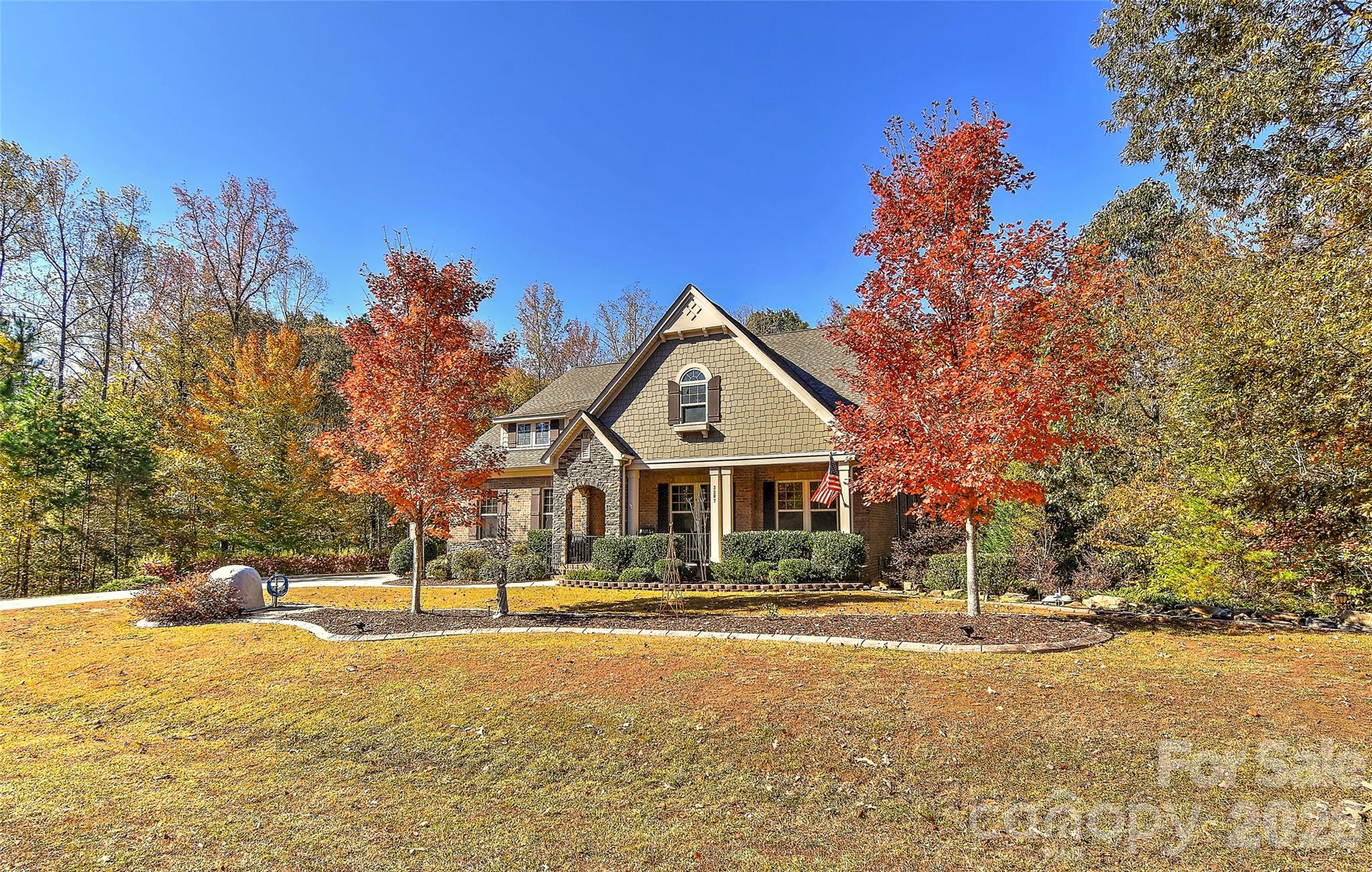 2287 Sweet Clover Way Denver, NC 28037 - Photo 2 of 44 a front view of a house with a yard and trees