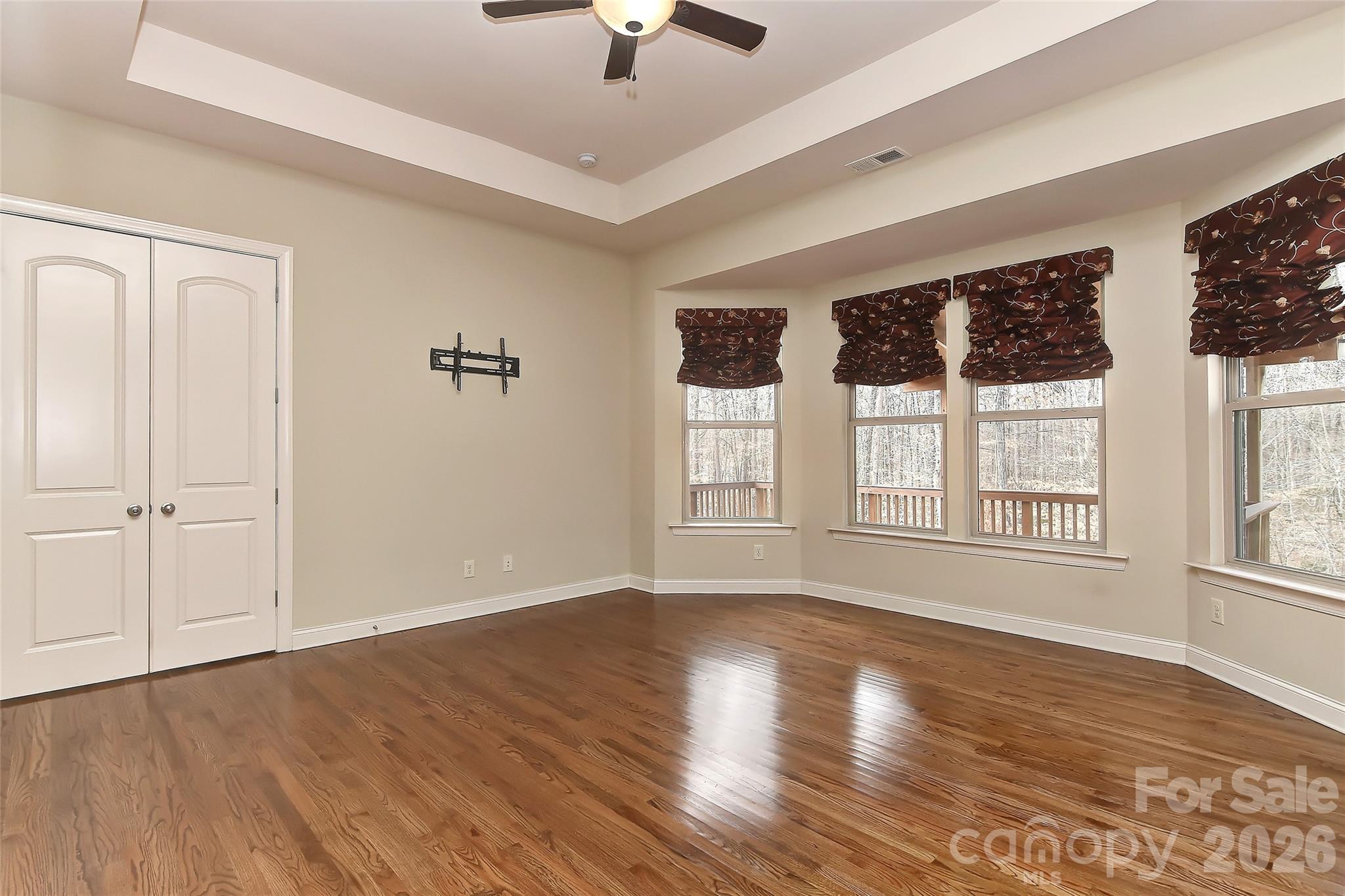 2287 Sweet Clover Way Denver, NC 28037 - Photo 22 of 44 a view of an empty room with wooden floor and a window