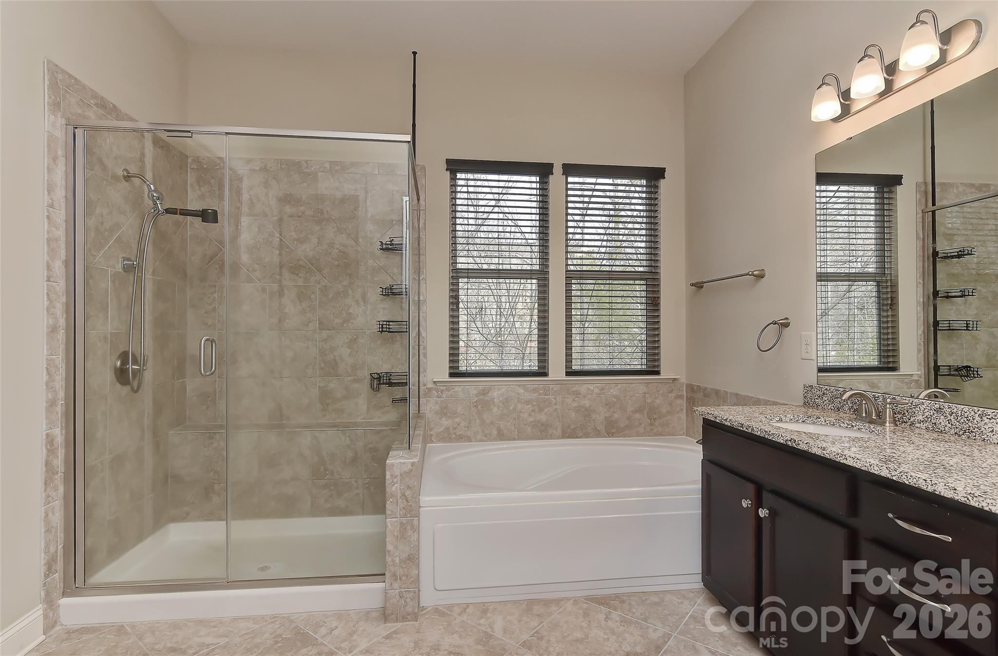 2287 Sweet Clover Way Denver, NC 28037 - Photo 25 of 44 a bathroom with a granite countertop sink a toilet and shower