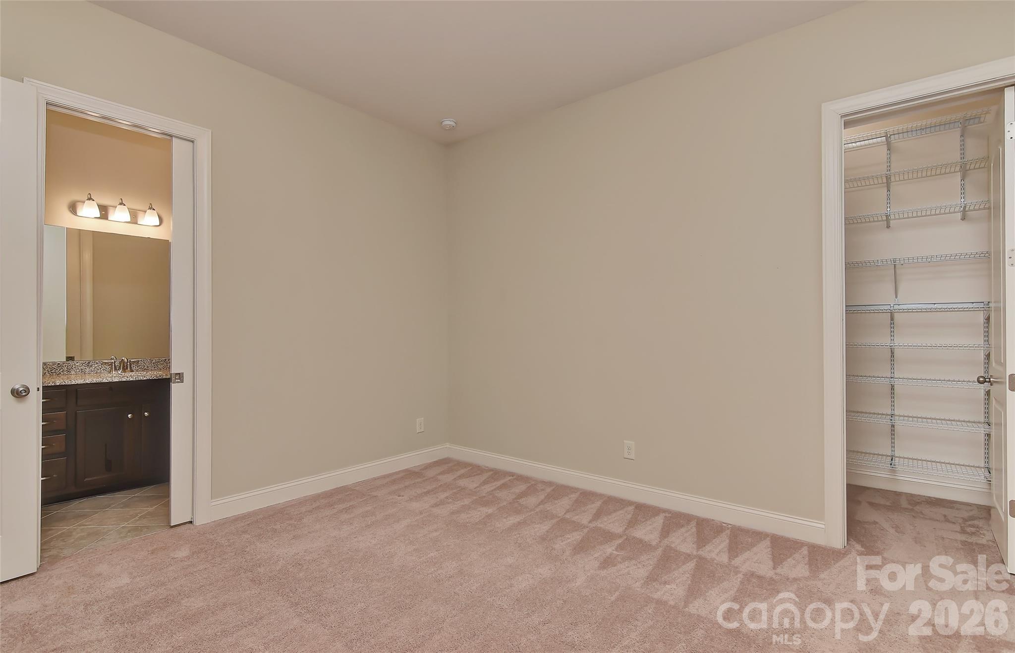 2287 Sweet Clover Way Denver, NC 28037 - Photo 27 of 44 an empty room with closet and a bathroom