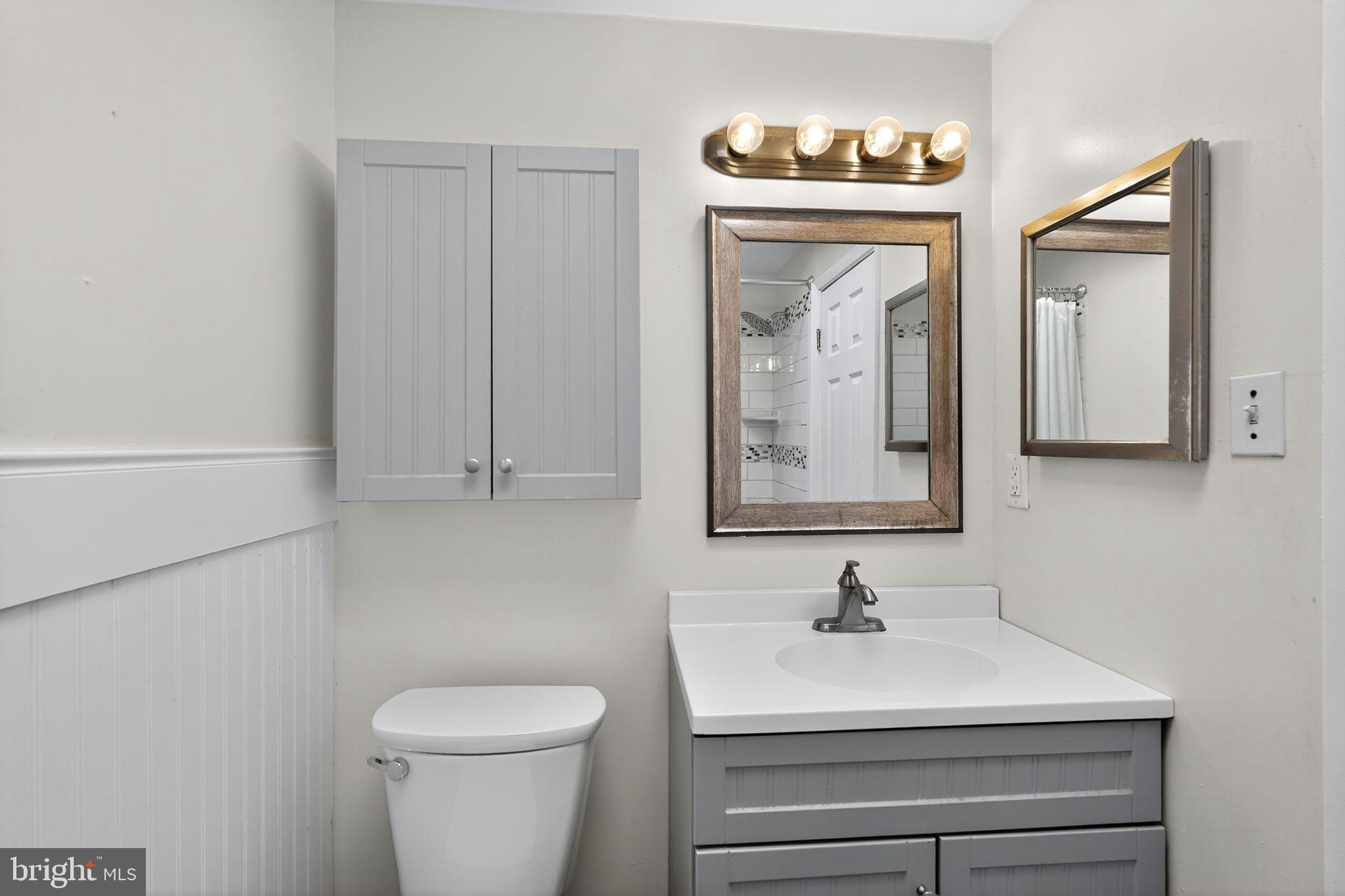 12791 Dunks Ferry Road Philadelphia, PA 19154 - Photo 11 of 26 a bathroom with a sink a toilet and a mirror