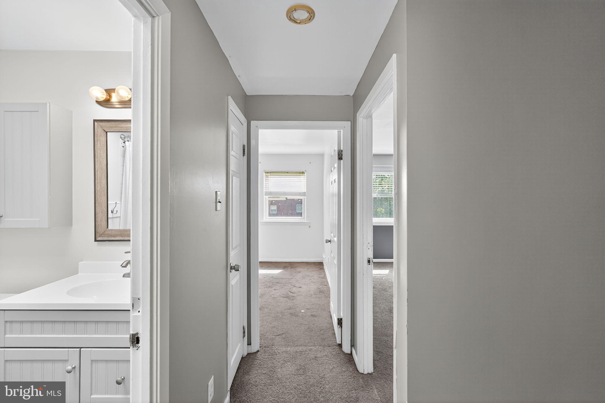12791 Dunks Ferry Road Philadelphia, PA 19154 - Photo 12 of 26 a view of a bathroom from a hallway