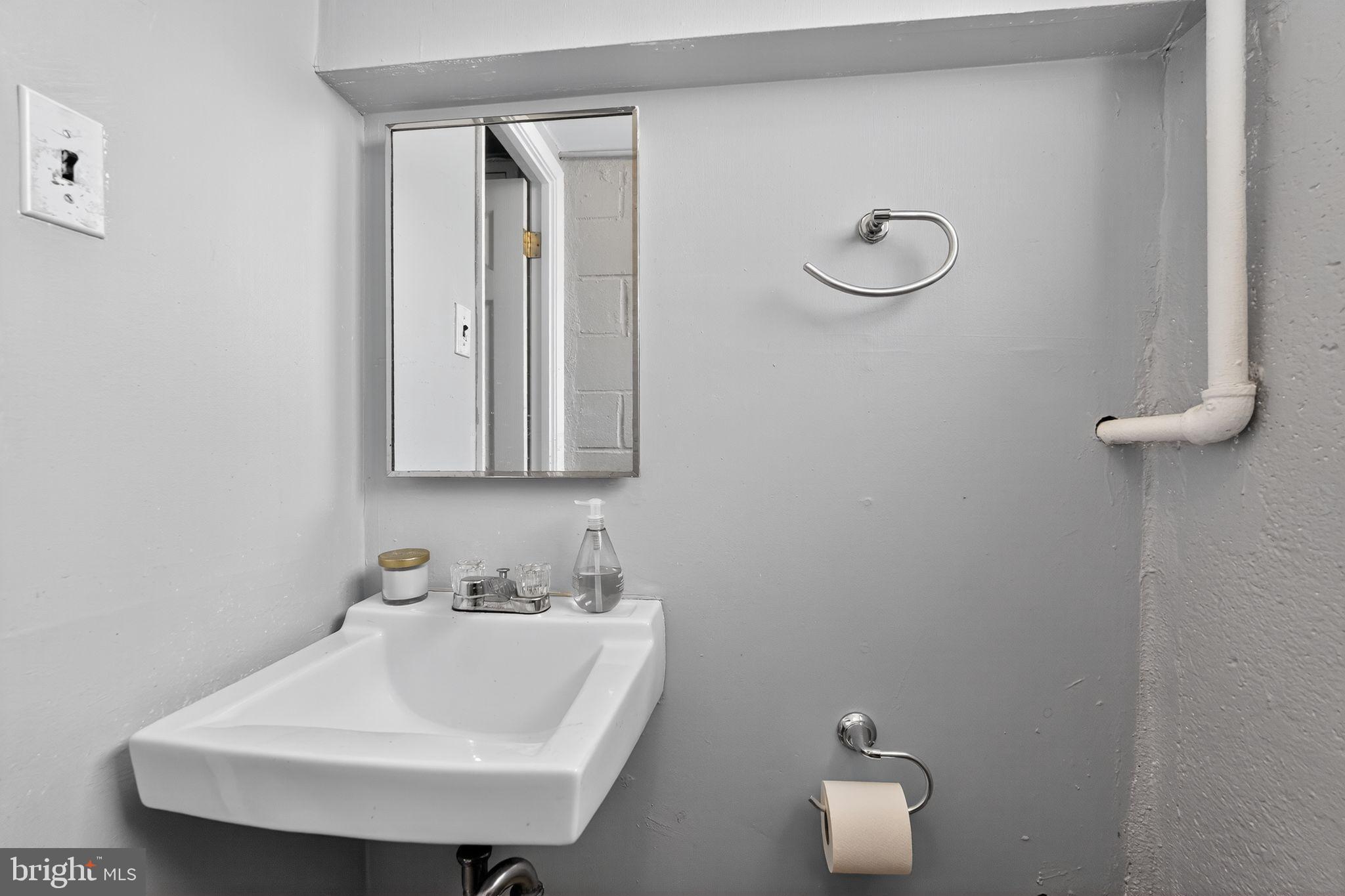 12791 Dunks Ferry Road Philadelphia, PA 19154 - Photo 24 of 26 a bathroom with a sink and a mirror