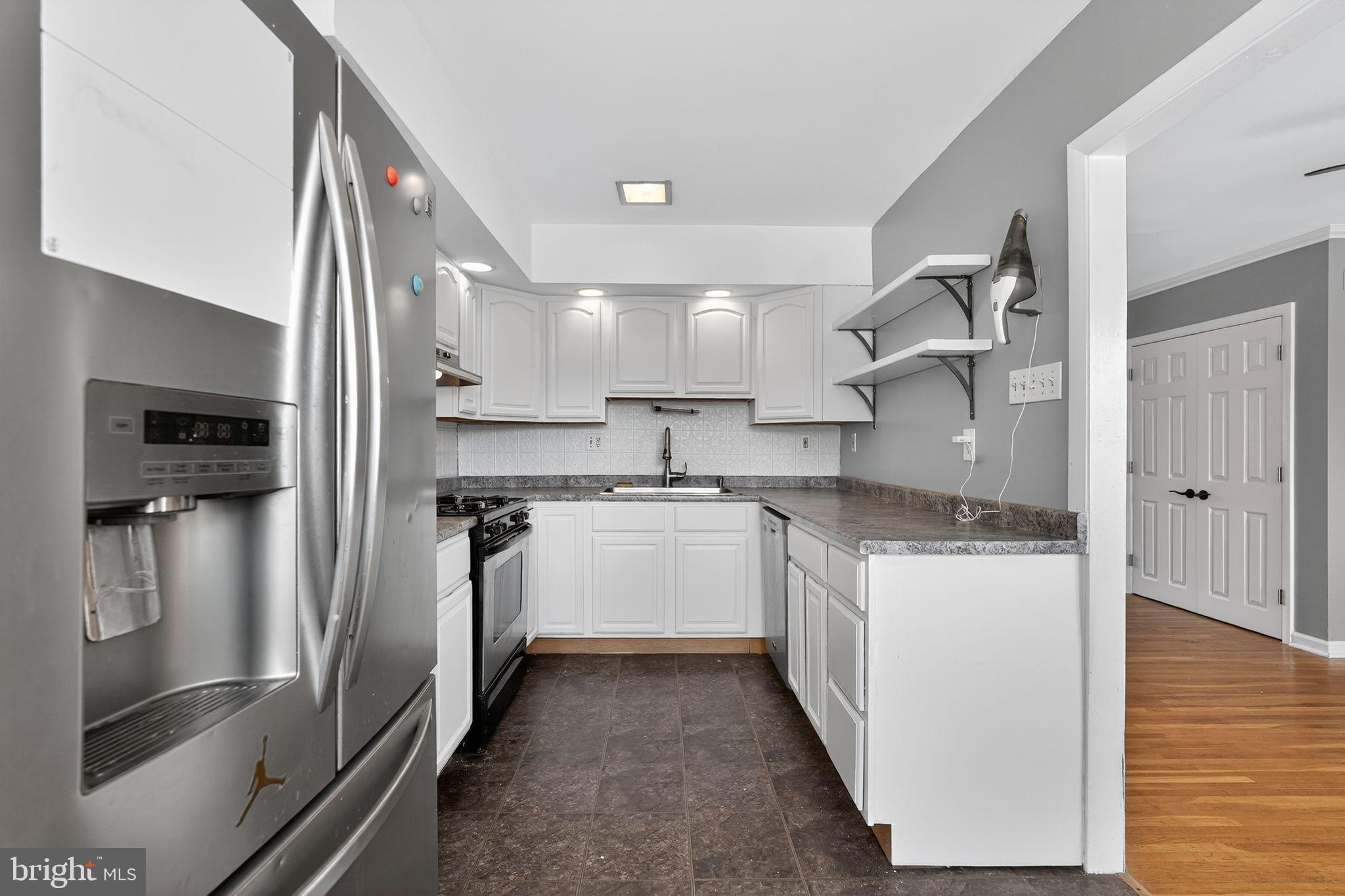 12791 Dunks Ferry Road Philadelphia, PA 19154 - Photo 8 of 26 a kitchen with stainless steel appliances granite countertop a refrigerator and a sink