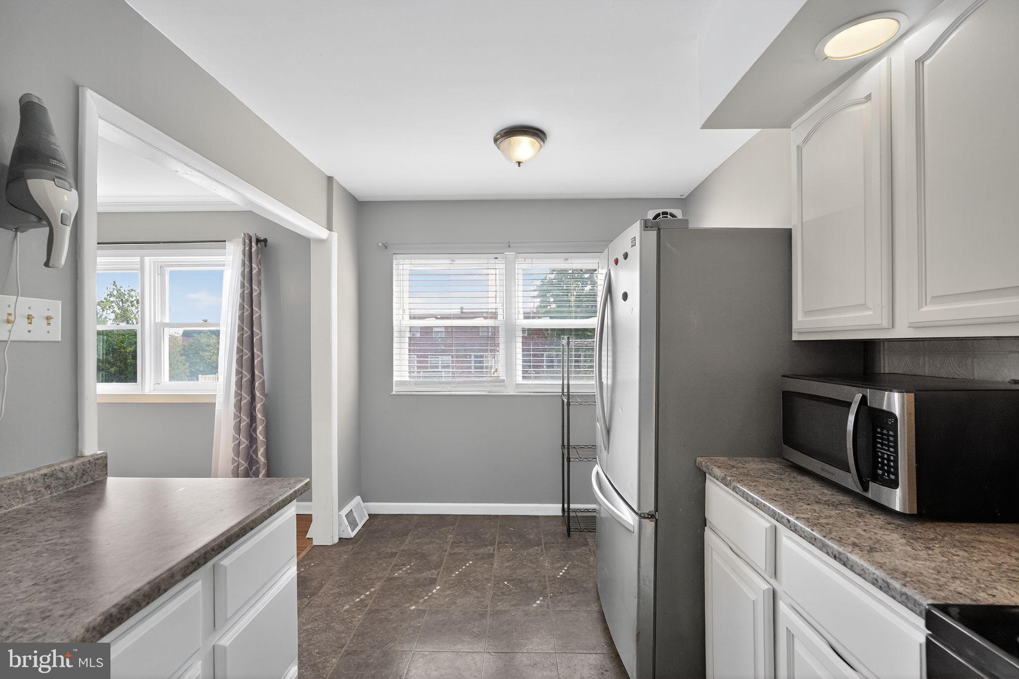 12791 Dunks Ferry Road Philadelphia, PA 19154 - Photo 9 of 26 a kitchen that has a cabinets and a stove