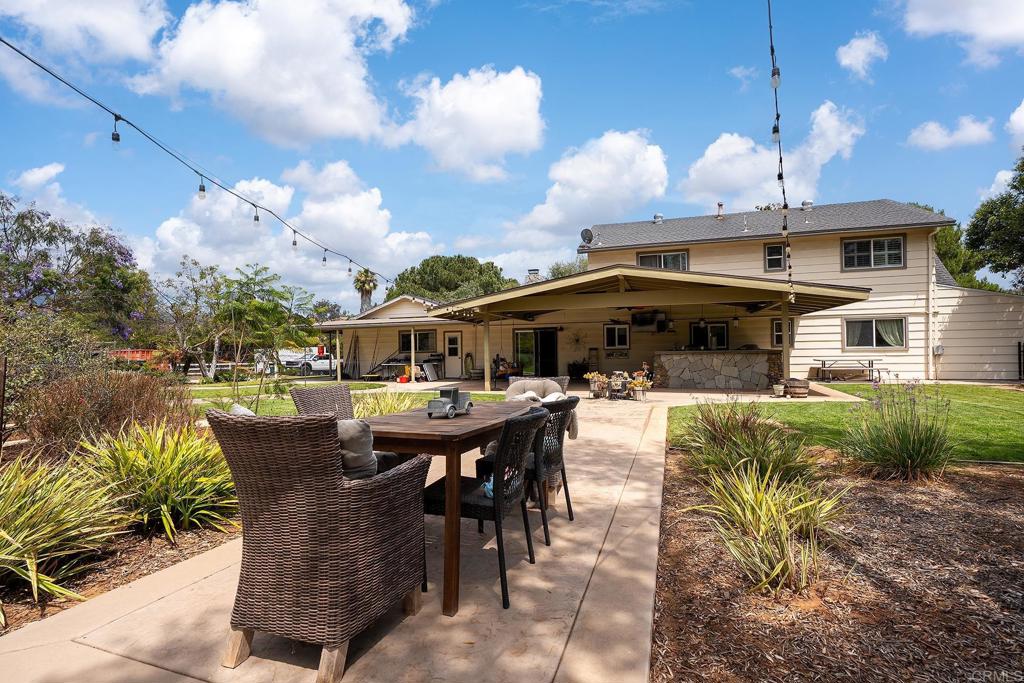 2430 Geyer Lane Alpine, CA 91901 - Photo 35 of 60 a view of a patio with table and chairs and potted plants