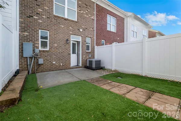 a view of a back yard of the house
