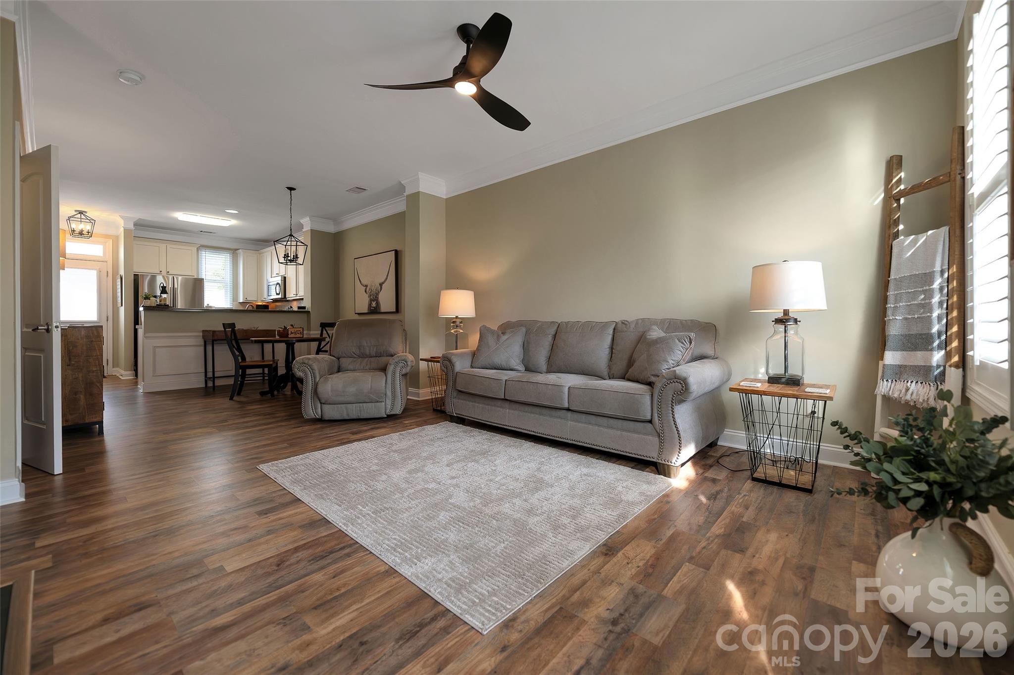 1213 Assembly Street Belmont, NC 28012 - Photo 7 of 32 a living room with furniture and a wooden floor