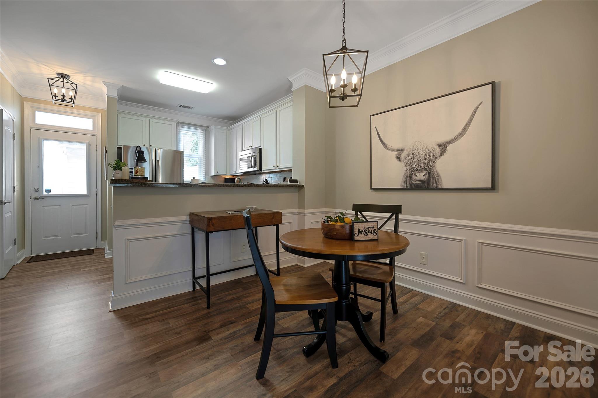 1213 Assembly Street Belmont, NC 28012 - Photo 9 of 32 a view of a dining room with furniture and wooden floor